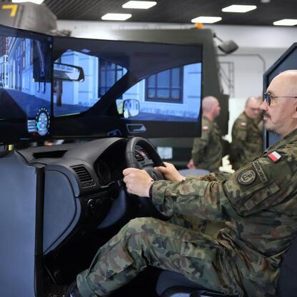 Soldier training in a driving simulator at WORD in Katowice, part of the 13th Silesian Territorial Defense Brigade initiative. (wygenerowano przez AI)